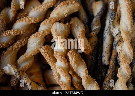 Shallow depth of field (selective focus) and macro image with sesame and poppy seeds breadsticks. Stock Photo