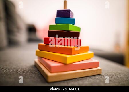 Shallow depth of field (selective focus) image with details of colorful wood blocks toy for children. Stock Photo