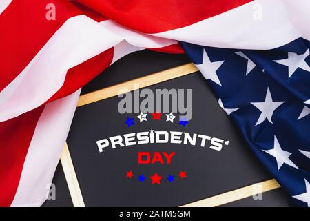 Happy Presidents' Day typography over blackboard background with US American flag border Stock Photo