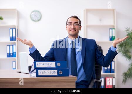 The young male accountant working in the office Stock Photo