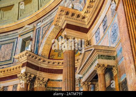 Rome, Lazio / Italy - 2019/06/17: Interior of Roman Pantheon ancient temple, presently catholic Basilica, with its reach decorations and arches Stock Photo