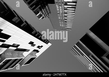 Black & white wide view of Solaria tower (143 m), Aria tower (100 m) and Solea tower (69 m) from Alvar Aalto square, Milan, Italy Stock Photo