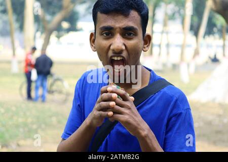 Young man feel surprise with Mouth open.Excited asian young boy.Get Foodies Excited Bangladeshi.Asian man feeling excited.Young man with a surprised Stock Photo