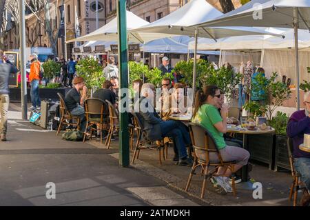 Sydney, Australia - July 23, 2016: People dining at outdoor restaurant in The Rocks precinct in Sydney Stock Photo