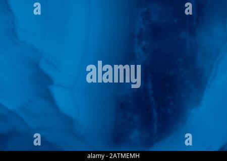 Abstract marble background in blue trendy colors. Texture of marble surface great for design. Close up. Stock Photo