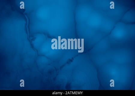 Abstract marble background in blue trendy colors. Texture of marble surface great for design. Close up. Stock Photo