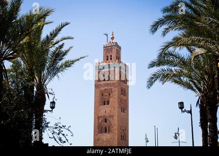 A view of the Koutoubia Mosque's minaret trhough palm trees in Marrakesh, Morocco