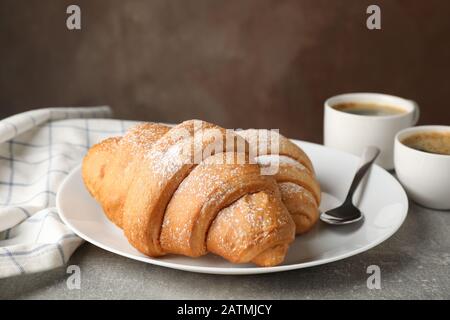 Composition with tasty croissants on grey table, close up Stock Photo