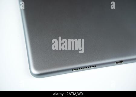 Brand new tablet isolated on white background, speaker detail Stock Photo
