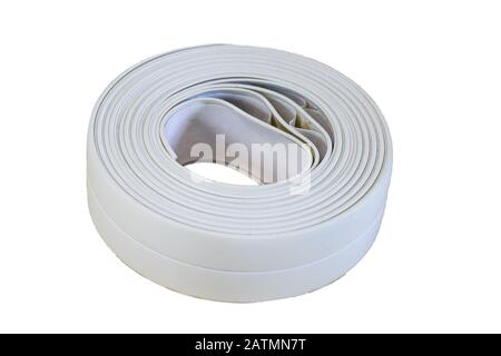 Bath tape. Roll of white adhesive flexible caulk strip isolated on white. Stock Photo