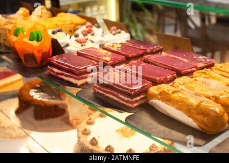 Different types of cakes pieces in pastry shop Stock Photo