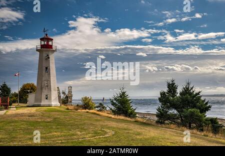 Cape Mudge Lighthouse, 1916, over Discovery Passage, at Quadra Island, British Columbia, Canada Stock Photo