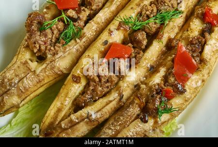 Puerto Rican  Stuffed Baked Plantains, roasted plantains filled with seasoned ground meat, tomatoes, onions, bell pepper, and spices Stock Photo