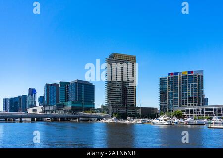 Modern buildings on the bank of river on sunny day. Docklands, Melbourne, Australia Stock Photo