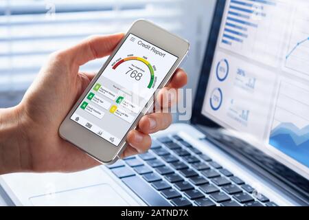 Credit Report with Score rating app on smartphone screen showing creditworthiness of a person for loan and mortgage application based on payment histo Stock Photo