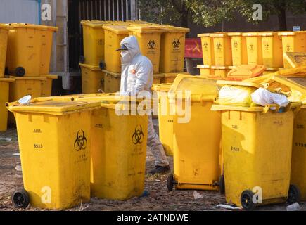 A Chinese medical worker processes medical wastes at Hankou Hospital in Wuhan City, central China's Hubei Province on February 4th, 2020. Stock Photo
