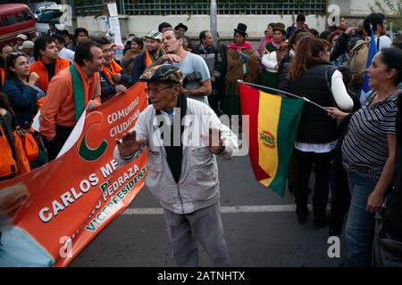 La Paz, Bolivia. 3rd Feb 2020.  An old man stands in front of the Supreme Electoral Court between the supporters of two opposing presidential candidates in Bolivia. The events around the resignation of Evo Morales in November 2019 led to a strong polarization of the Bolivian society. Radoslaw Czajkowski/ Alamy Live News Stock Photo