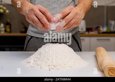 Closeup of mans hands making dough Stock Photo