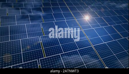 Solar energy panels with sun reflection and blue sky in background. Green power, ecology, clean and alternative energy source concept. Photovoltaic ce Stock Photo