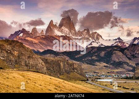 Cerro Fitz Roy range at sunrise, Andes Mountains, Los Glaciares National Park, over town of El Chalten, Patagonia, Argentina Stock Photo