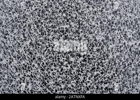 Abstract white pattern of a cracked glass pane Stock Photo