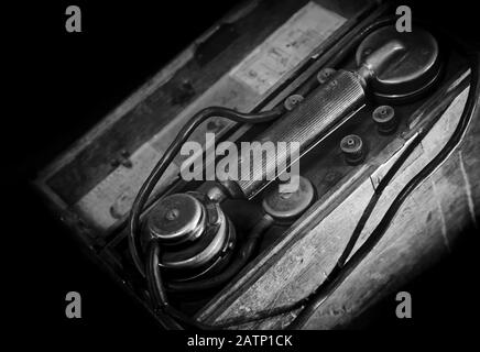 Vintage weathered military telephone from WWII period. Black and white photo Stock Photo