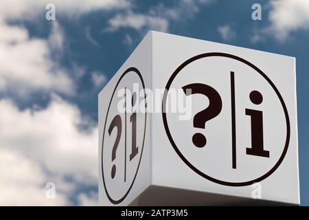 White cube shaped notice sign with question and exclamation marks against a blue cloudy sky Stock Photo