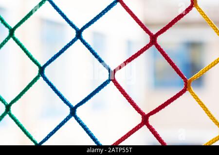 Mesh of colored ropes close up, background Stock Photo