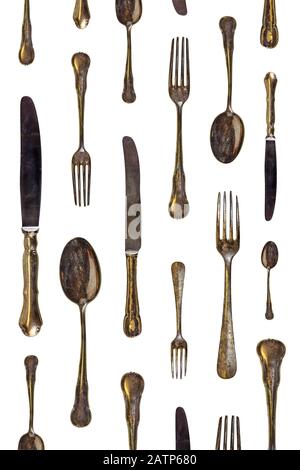 Pattern of vintage spoons, knives and forks isolated on a white background Stock Photo