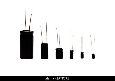 Different capacitors in row isolated on white Stock Photo