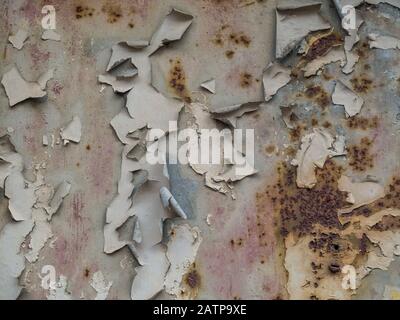 Rust flaking off a wall Stock Photo