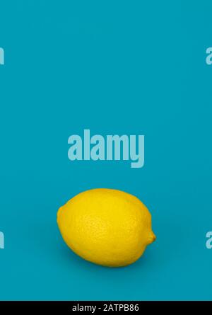 yellow lemon on blue background Stock Photo