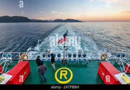Quelat ferry on its way at dawn to Puerto Raul Marin Balamaceda, Aysen Region, Patagonia, Chile Stock Photo