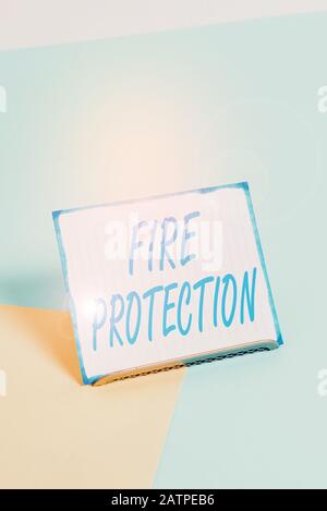 Conceptual hand writing showing Fire Protection. Concept meaning measures taken to prevent fire from becoming destructive Paper on buffer wire on soft Stock Photo
