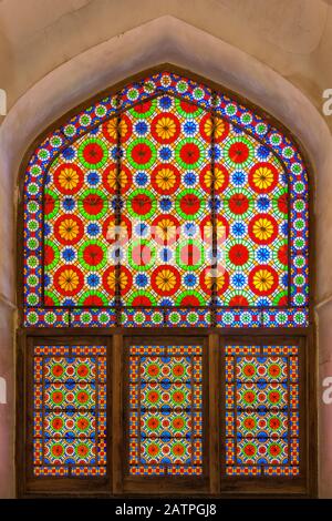 Colourful stained glass window in Dolat Abad Garden Pavilion, Yazd, Iran Stock Photo