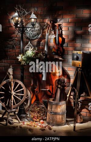 Still life with old double bass, violin and historic photo camera in country style, Russia Stock Photo