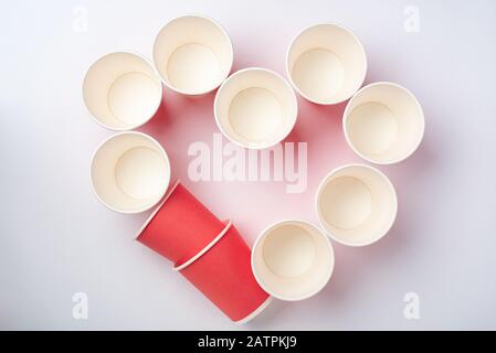 Multicolored beautiful eco paper party cups on white background Stock Photo