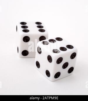 Two dice rolling 11, shot against a white background Stock Photo - Alamy