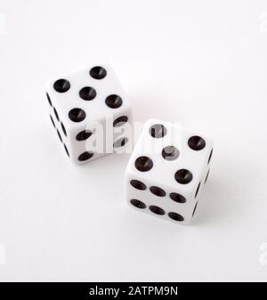 Two dice rolling 11, shot against a white background Stock Photo - Alamy