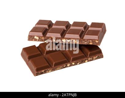 Milk chocolate pieces with nuts isolated on white background.  Chocolate bars lying on top of one another. Stock Photo