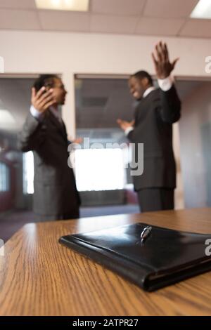 Young businessmen talking with each other. Stock Photo