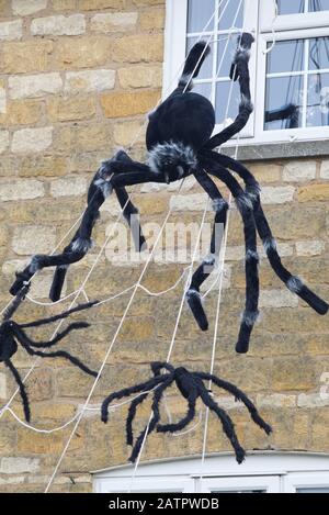 decorated house for Halloween in Snow hill, Giant spiders, cotswolds Stock Photo