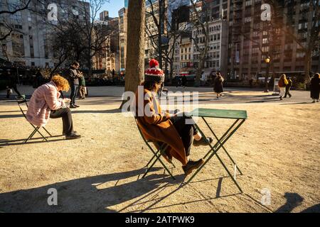 Visitors to Madison Square Park in New York on Monday, February 3, 2020 take advantage of the unseasonably warm winter weather.(© Richard B. Levine) Stock Photo