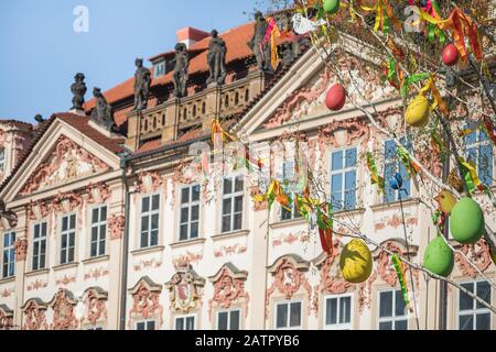 Easter tree with ribbon and eggs decorations on the streets with historical buildings in the background, Old town square, Prague, Czech Republic, copy Stock Photo