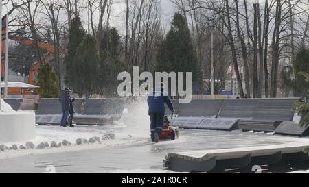 MOSCOW - December 20: Man using snow removal machine cleans snow in Moscow on December 20, 2018 in Moscow, Russia. Stock Photo