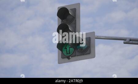 Traffic light changes from red to green. Stock Photo