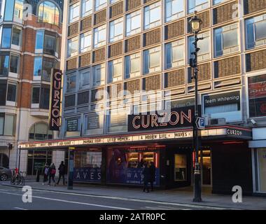 Curzon cinema on Shaftesbury Avenue in London in the afternoon sunlight.