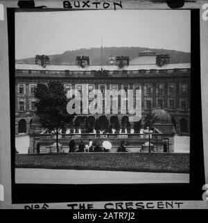 Buxton Crescent & Thermal Spa Hotel during the Victorian period c1890, Victorians in front of the Bath House, antique old glass magic lantern slide picture. The newly renovated hotel is due to open in 2020 creating a northern capital for health and wellbeing. Antique Magic Lantern Slide.  Original photographer unknown, copyright period expired.  Digital photography, restoration, editing copyright © Doug Blane. Stock Photo