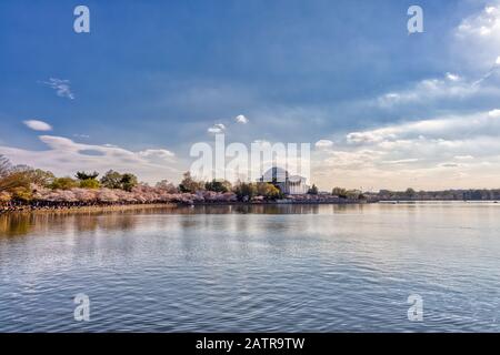 Washington D.C., USA - April 6, 2019: Tens of Thousands of Tourists Throng the Jefferson Memorial in the Tidal Basin in Washington DC for the Annual C Stock Photo