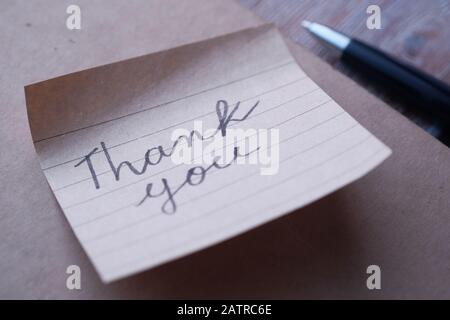 hand written thank you note on paper  Stock Photo